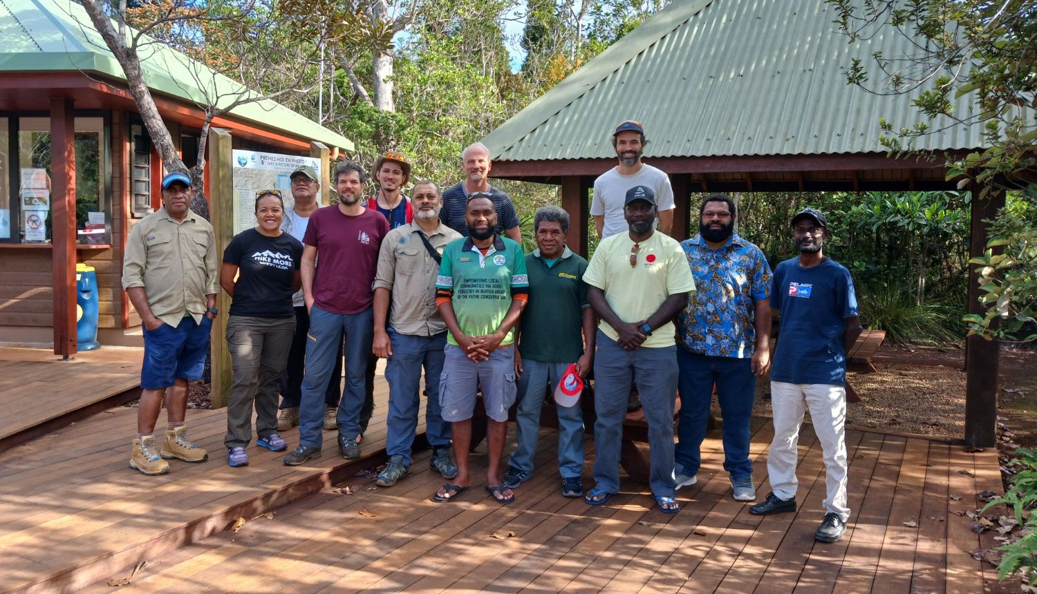 Group photo of MELANOBS partners on a wooden deck.